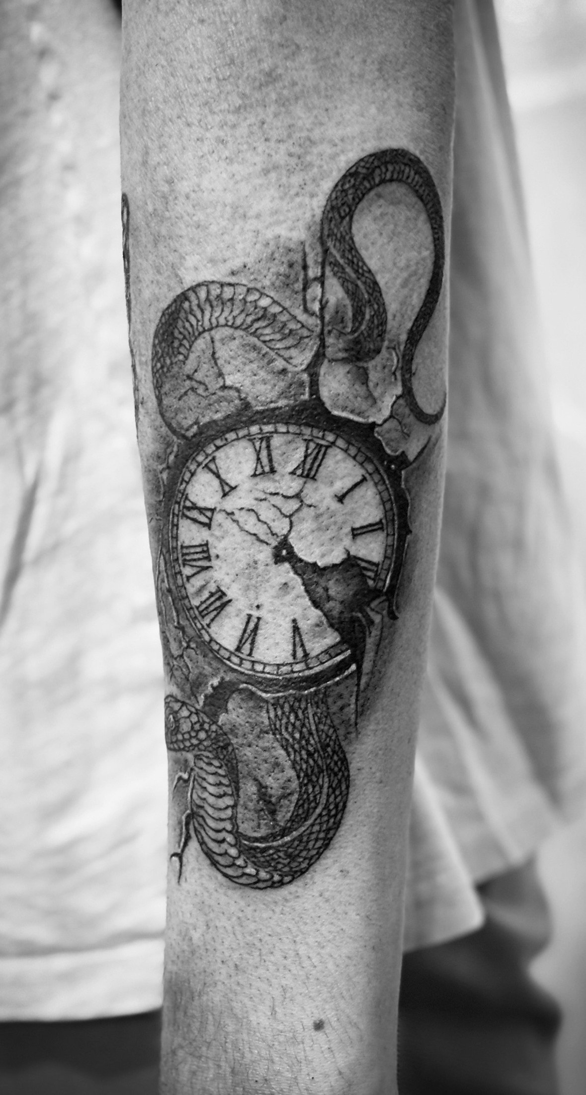 Tattoo: Uhr Schlange